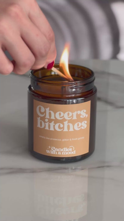 Lumânare parfumată din ceară de soia CHEERS BITCHES amber -sweet orange -patchouli 250g